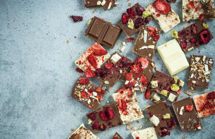 Artisan handmade chocolate pieces,border background